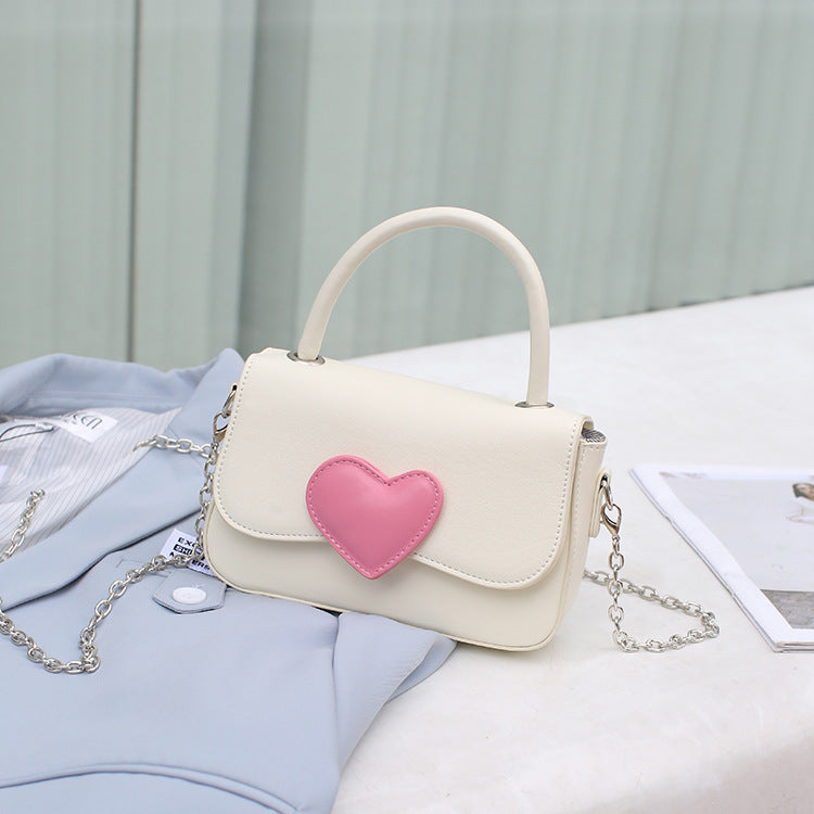 Contrast color peach heart crossbody bag